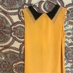 Unique yellow blouse. Zipper back.